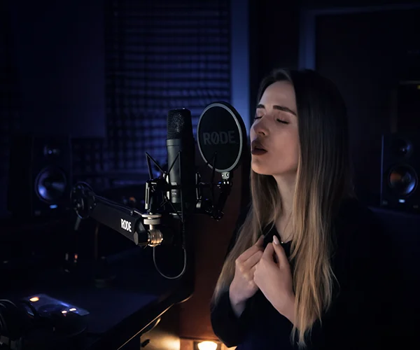 Artist recording vocals at microphone